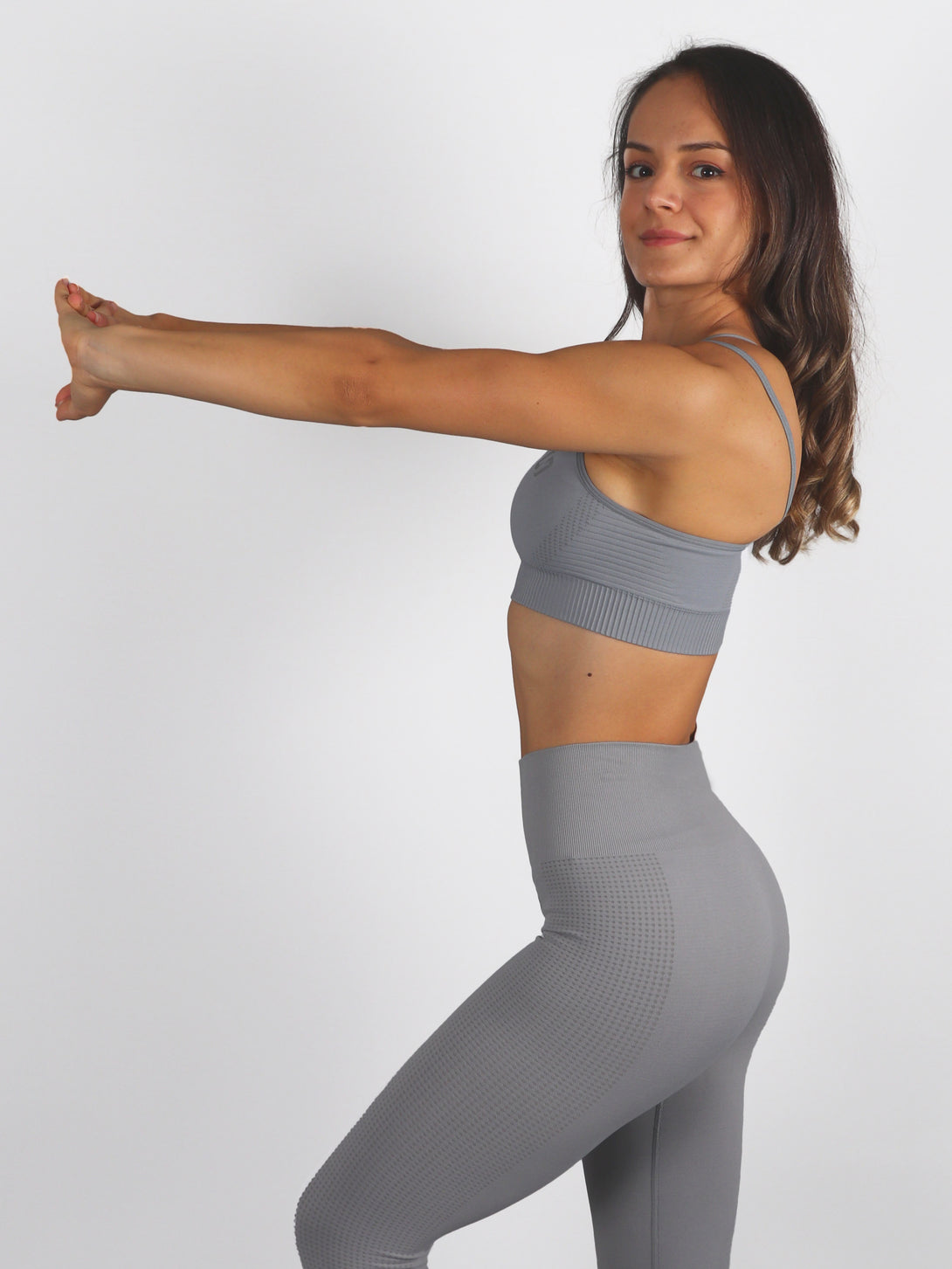 A Woman Wearing Dark Grey Color Seamless Light Support Sports Bra