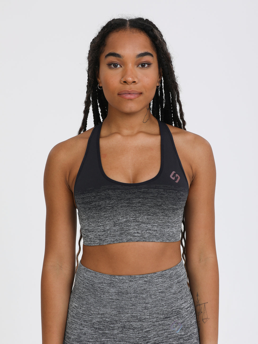 A woman wearing black color Seamless Ombre Medium Support Sports Bra