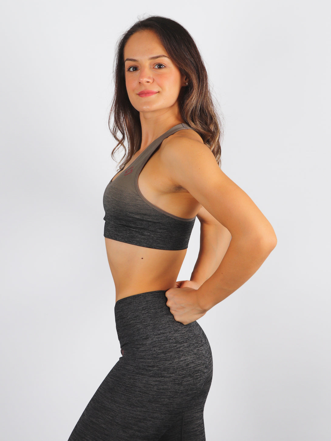 A woman wearing Khaki color Seamless Ombre Medium Support Sports Bra
