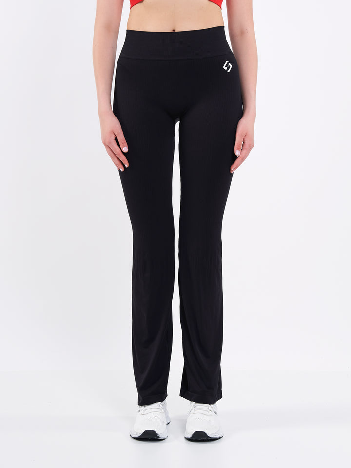 A Woman Wearing Deep Black Color Antigravity Seamless Flare-Leg Yoga Pants. Ultra-Light
