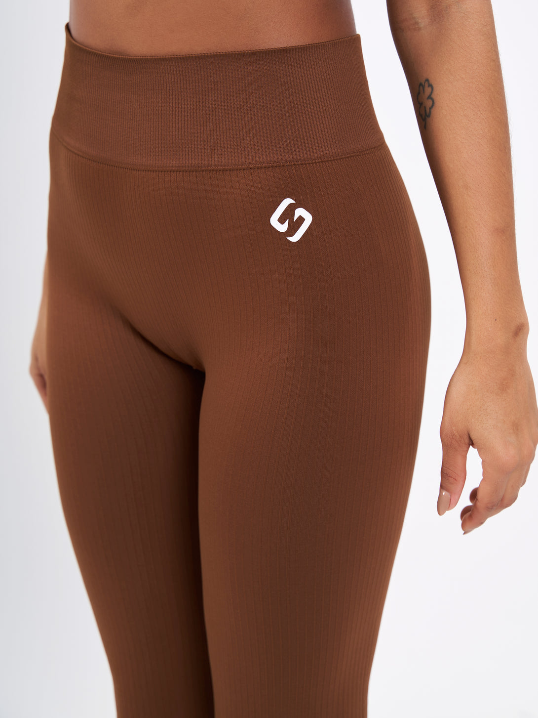A Woman Wearing Toffe Brown Color Antigravity Seamless Flare-Leg Yoga Pants. Ultra-Light