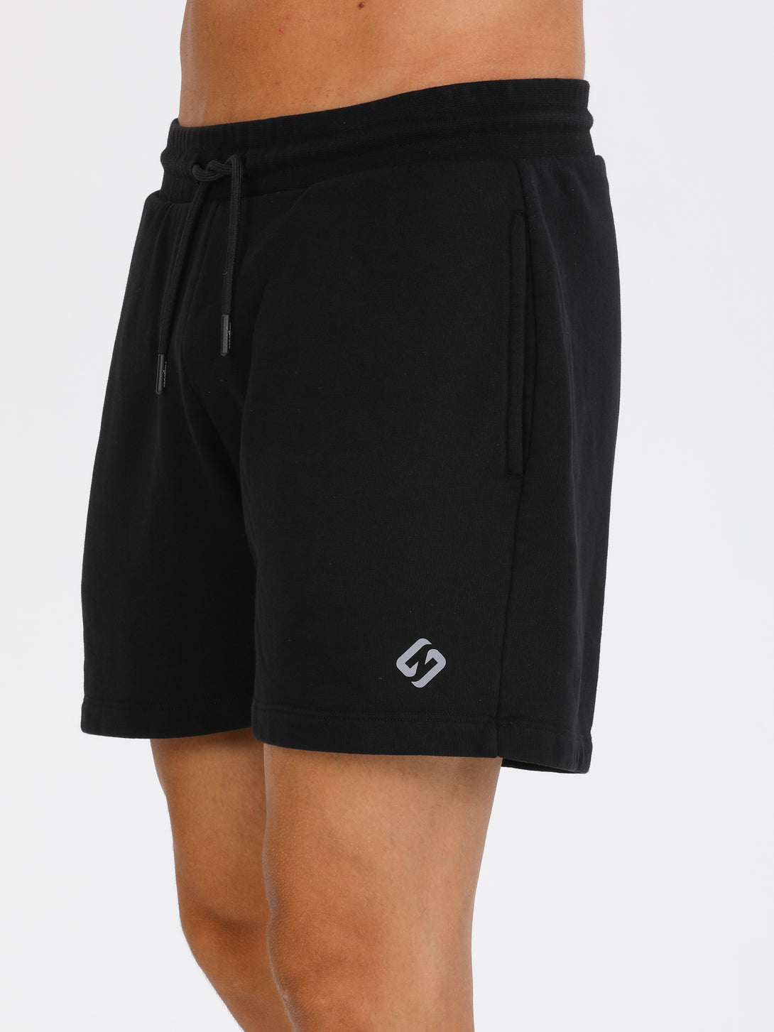 A Man Wearing Black Color Essential Mens Workout Shorts