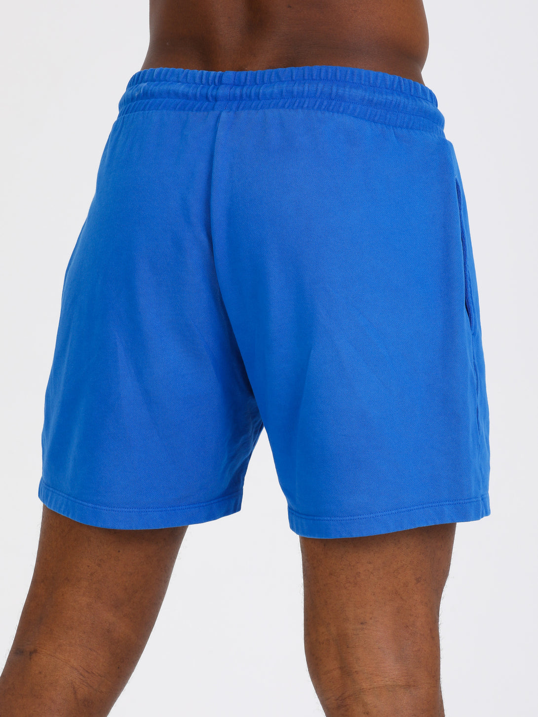 A Man Wearing Lapis Blue Color Essential Mens Workout Shorts