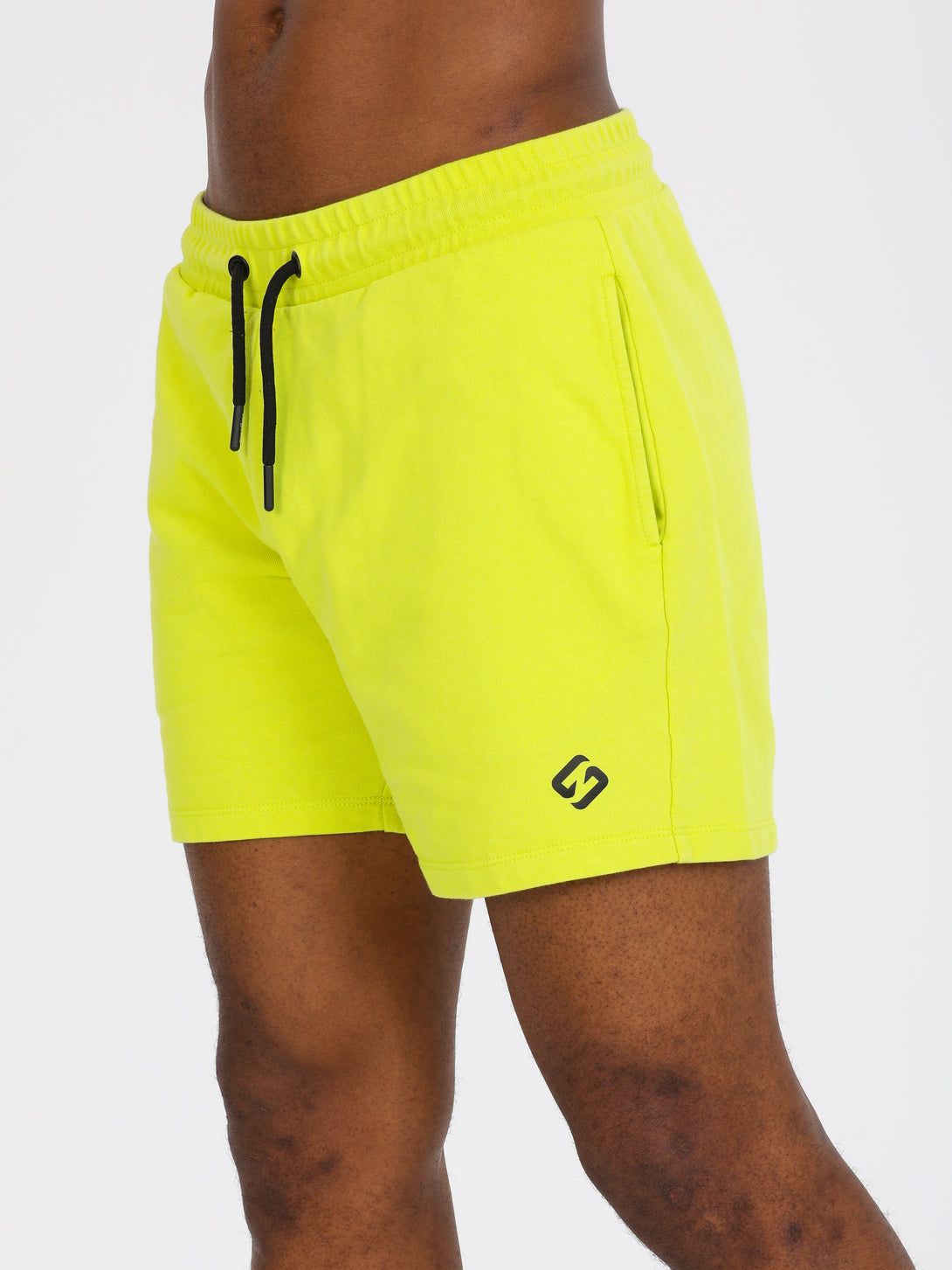 A Man Wearing Lime Color Essential Mens Workout Shorts