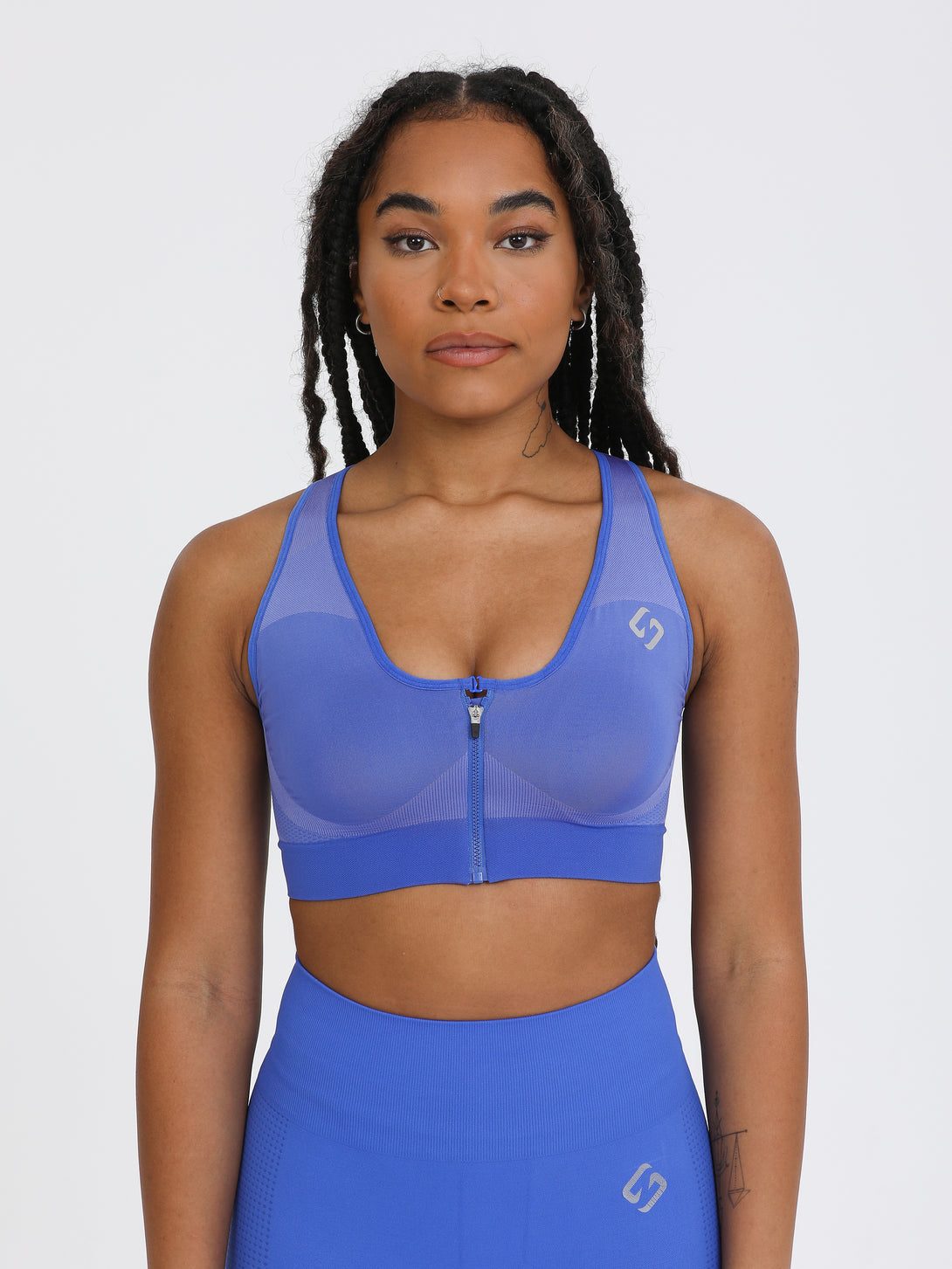A Woman Wearing Amparo Blue Color High Impact Sports Bra