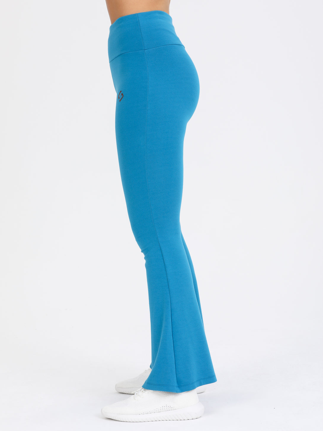 A Woman Wearing Saxony Blue Color Legacy Jersey Yoga Pants