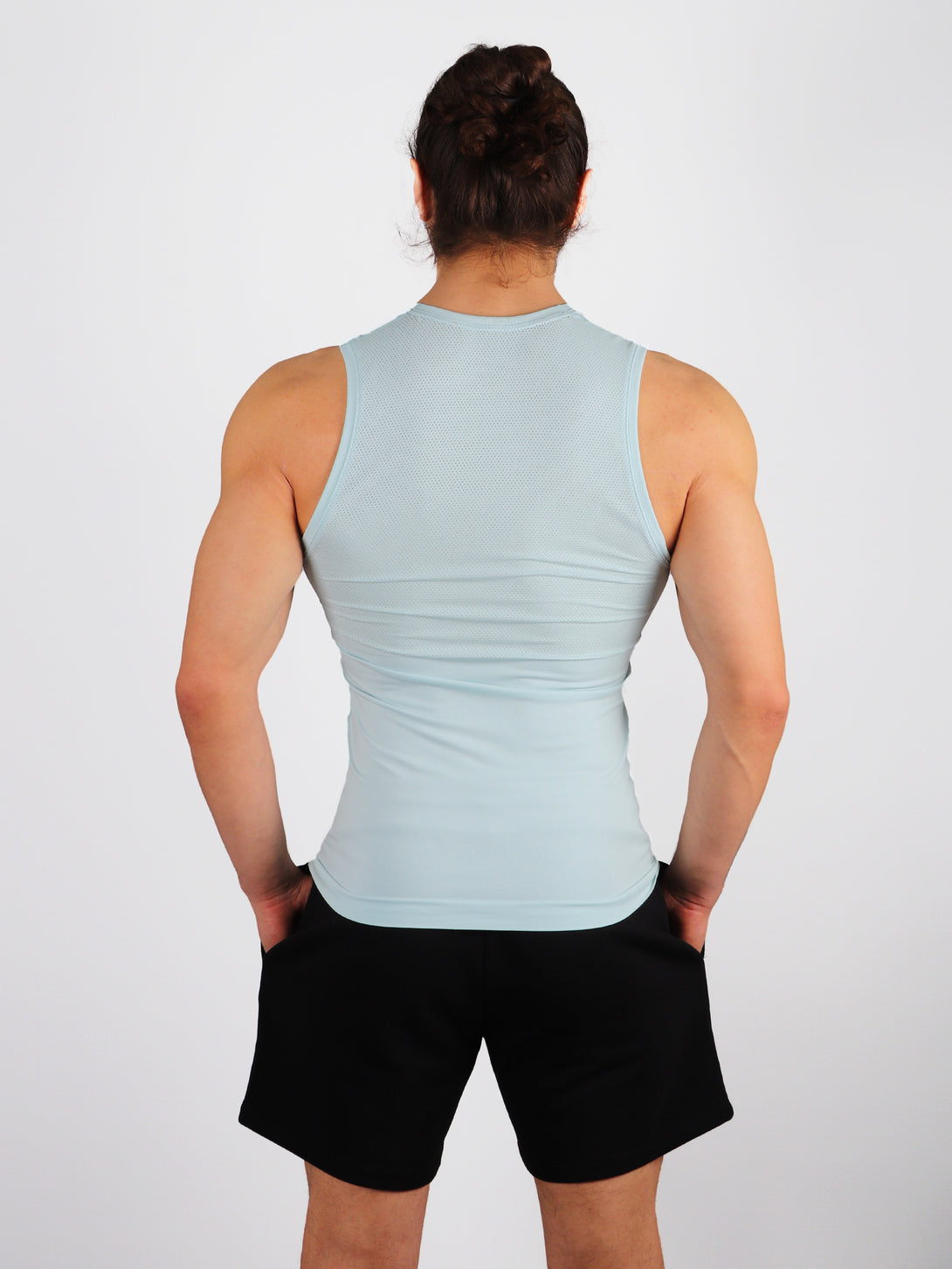A Man Wearing Baby Blue Color Seamless Mens Mesh Tank Top