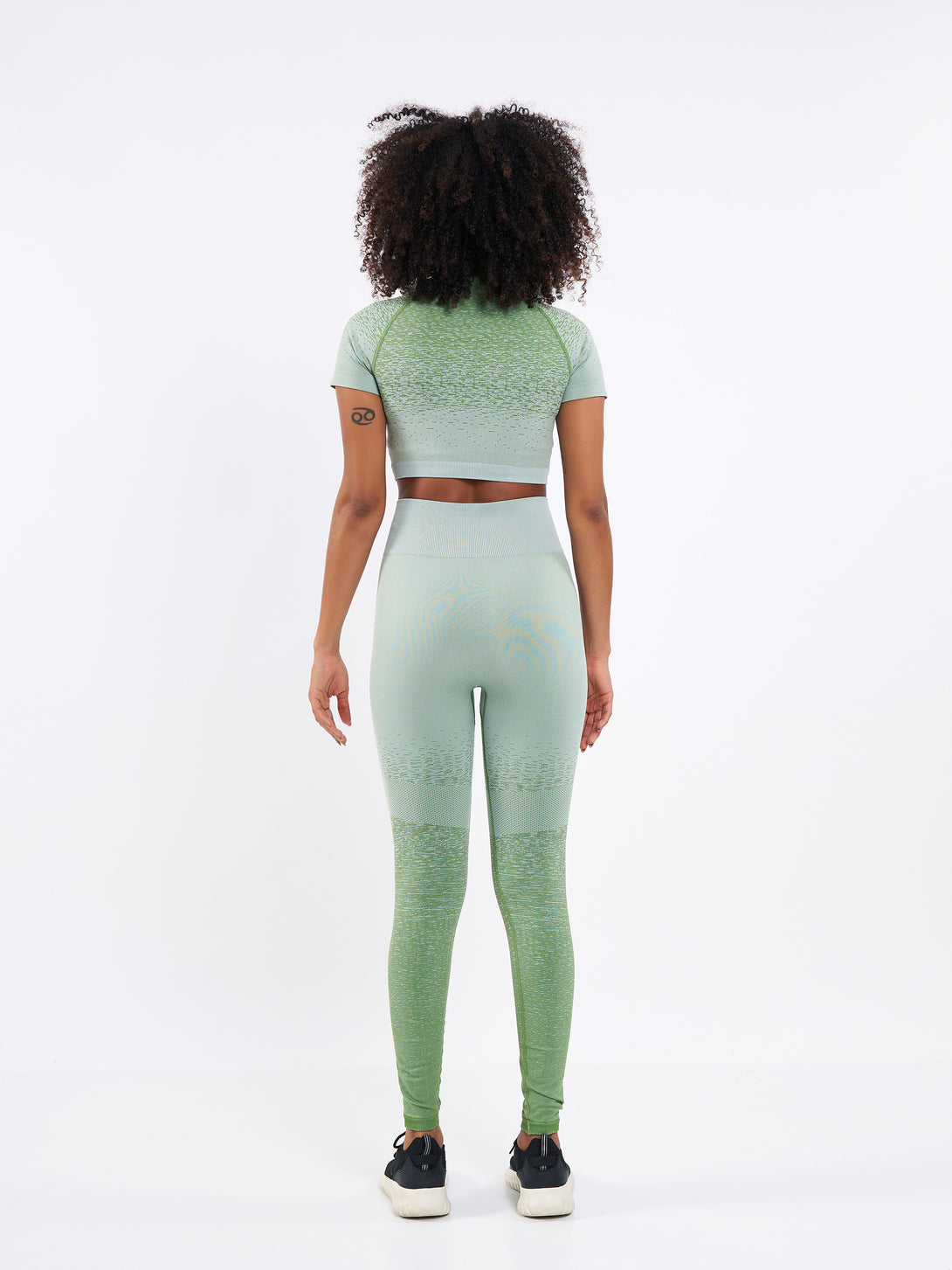 A Women Wearing Mist Green Color Seamless High-Waist Leggings with Ombre Effect. Chic Comfort