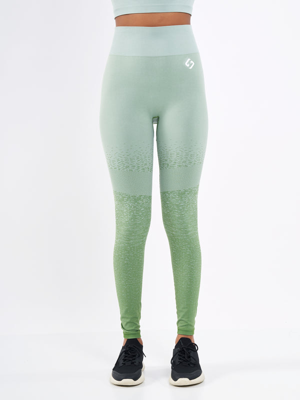 Color_Misty Green | A Women Wearing Misty Green Color Seamless High-Waist Leggings with Ombre Effect. Chic Comfort