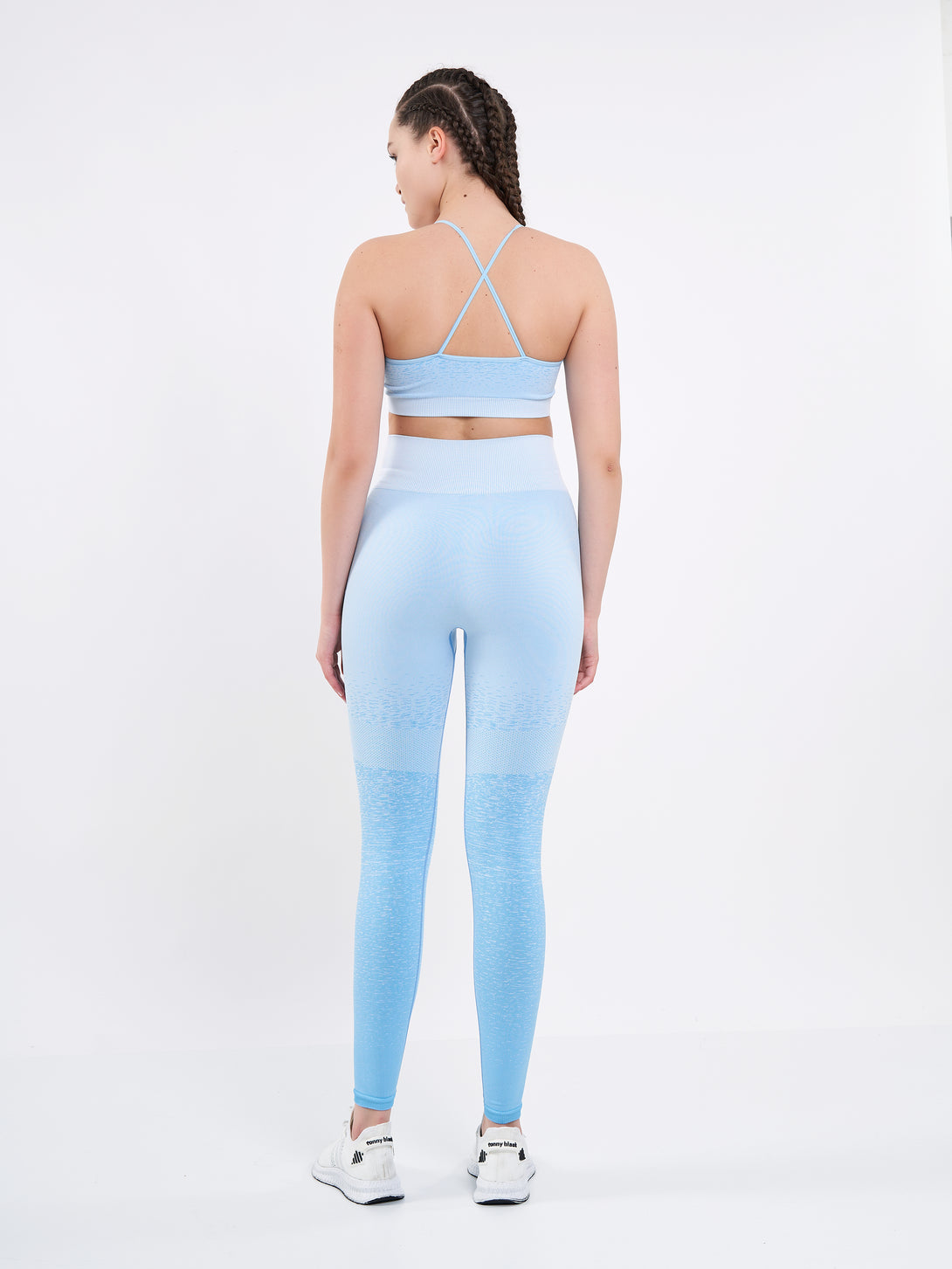 A Women Wearing Sky Blue Color Seamless High-Waist Leggings with Ombre Effect. Chic Comfort