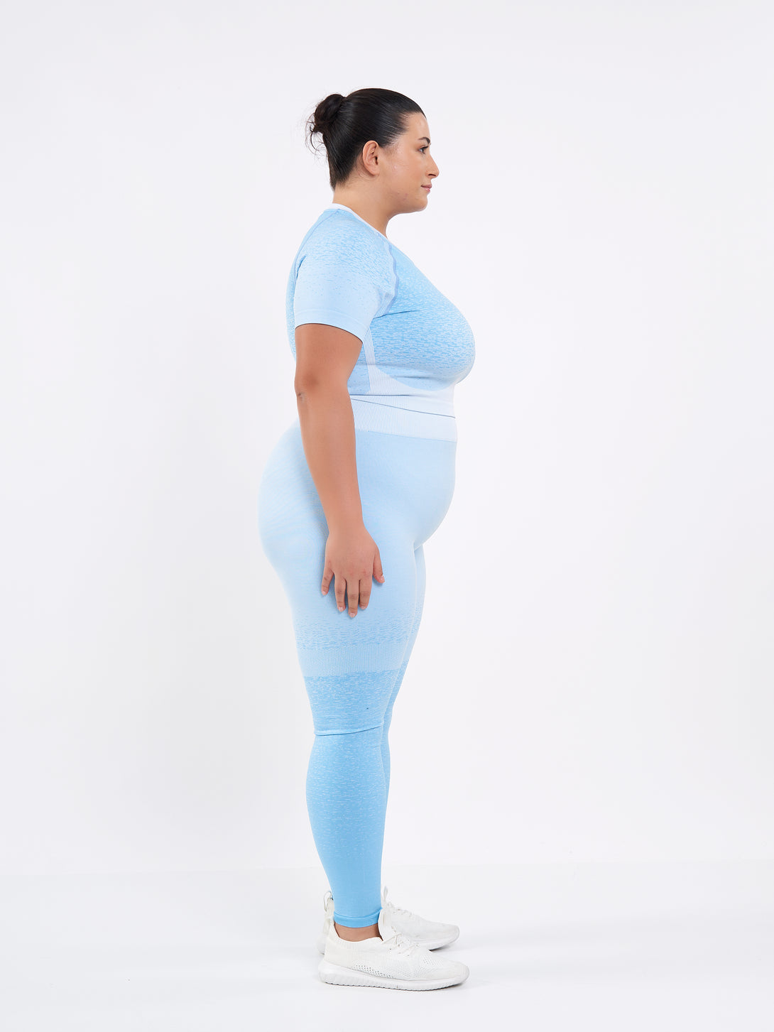 A Women Wearing Sky Blue Color Seamless High-Waist Leggings with Ombre Effect. Chic Comfort