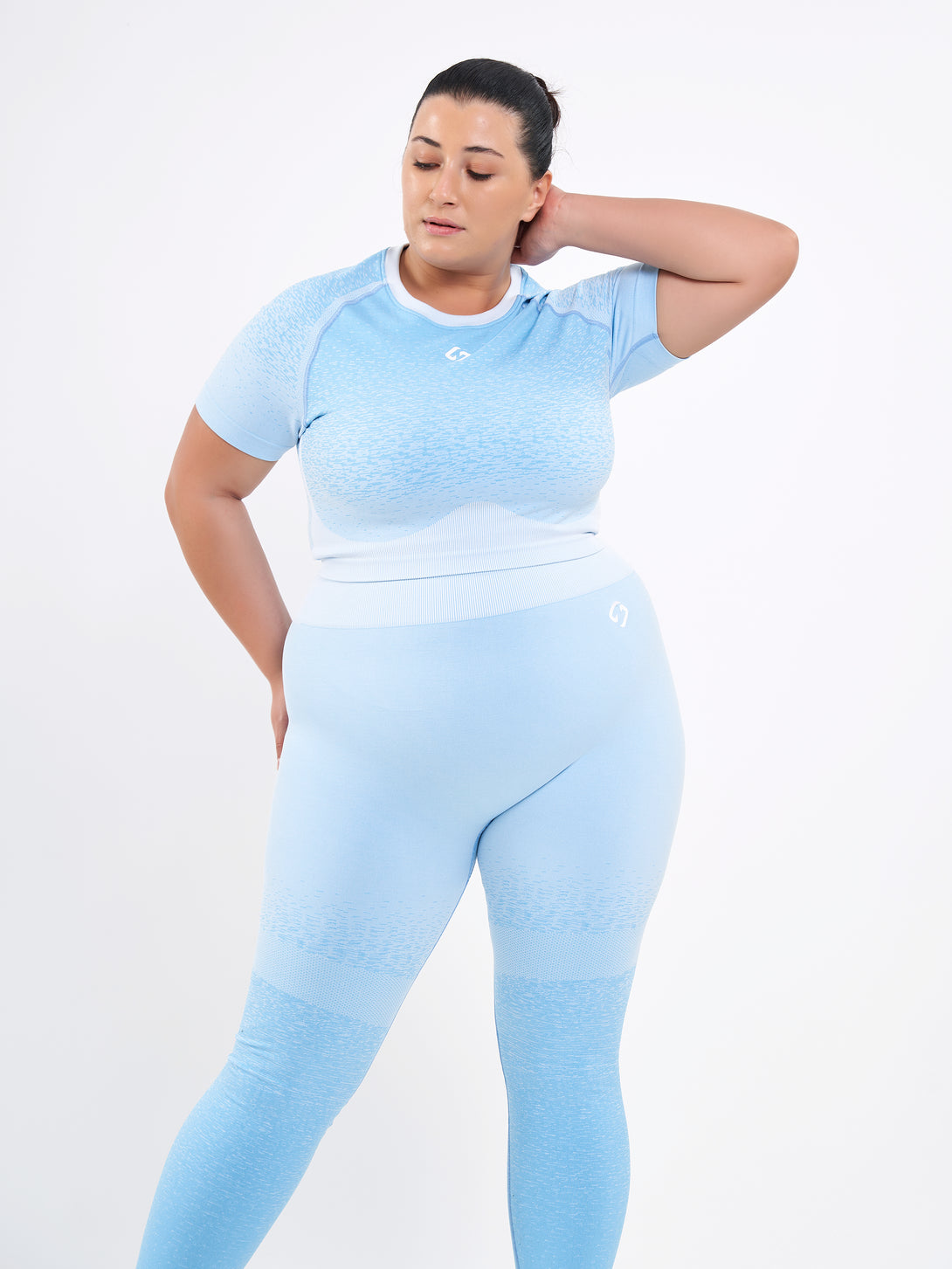 A Woman Wearing Sky Blue Color Seamless Crop Top with Ombre Effect. Chic Comfort