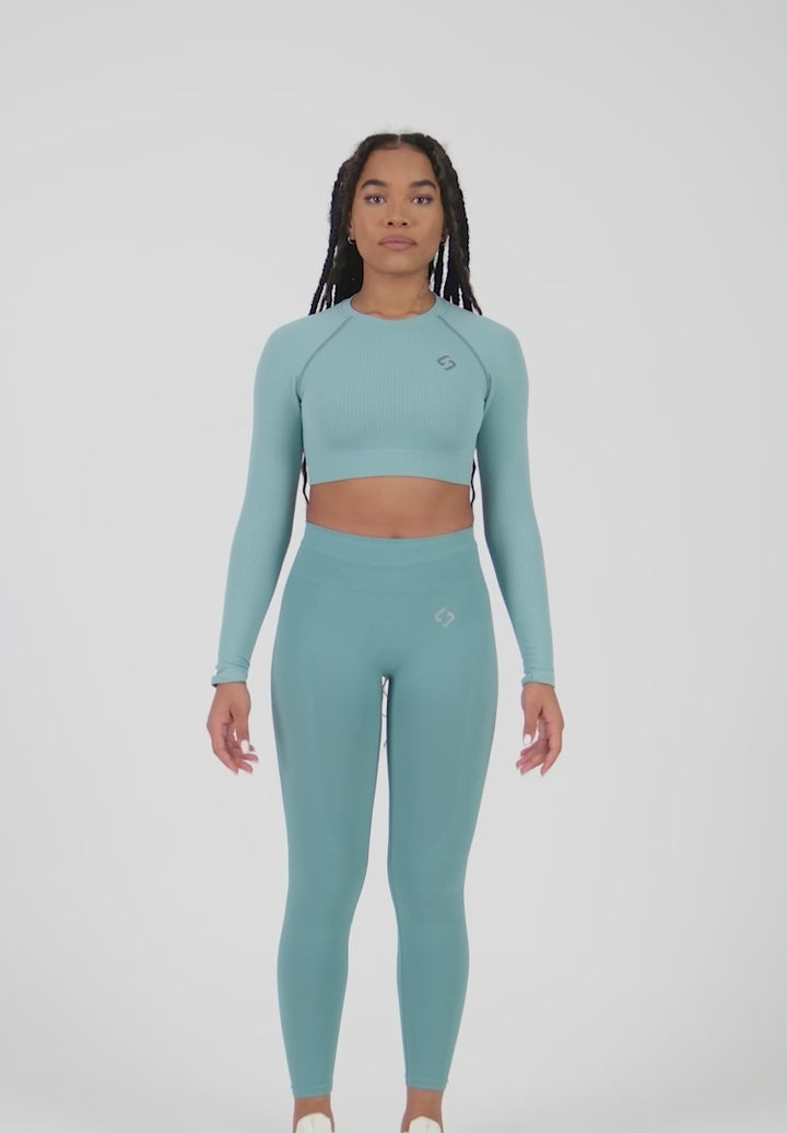 A Woman Wearing Sapphire Color The Main Long Sleeve Crop Top