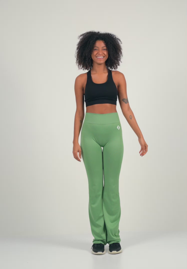 A Woman Wearing Deep Black Color Antigravity Seamless Flare-Leg Yoga Pants. Ultra-Light