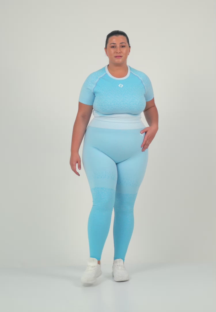 A Woman Wearing Sky Blue Color Seamless Crop Top with Ombre Effect. Chic Comfort