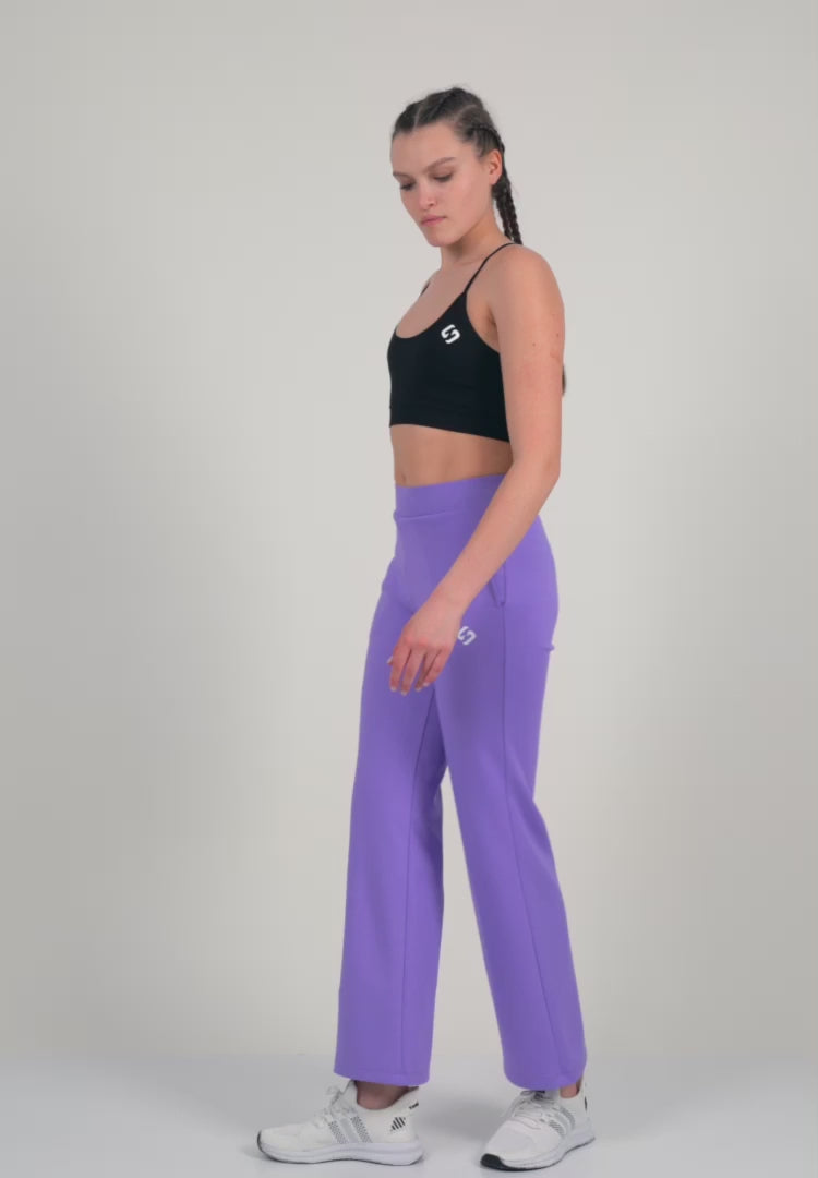 A Woman Wearing Paisley Purple Color Durable Flare-Leg Comfort Joggers for All-Day Wear