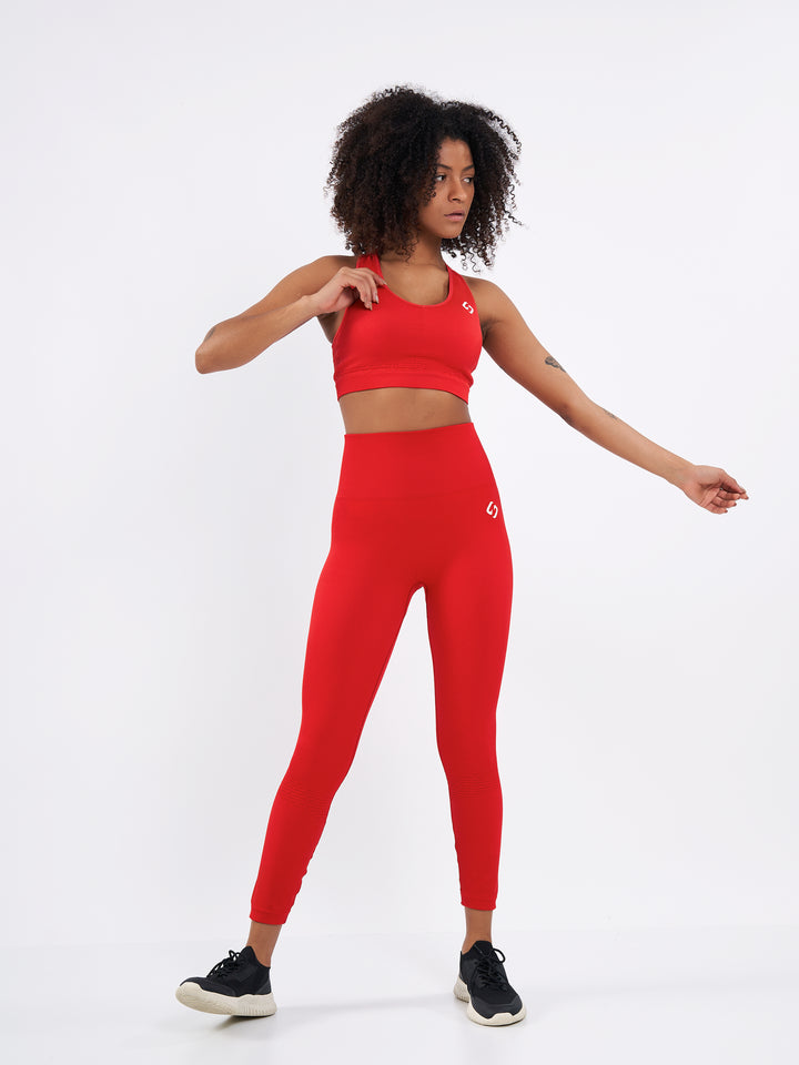 A Woman Wearing Bright Red Color Seamless High-Waist Ankle-Length Ribbed Leggings. Super-Soft