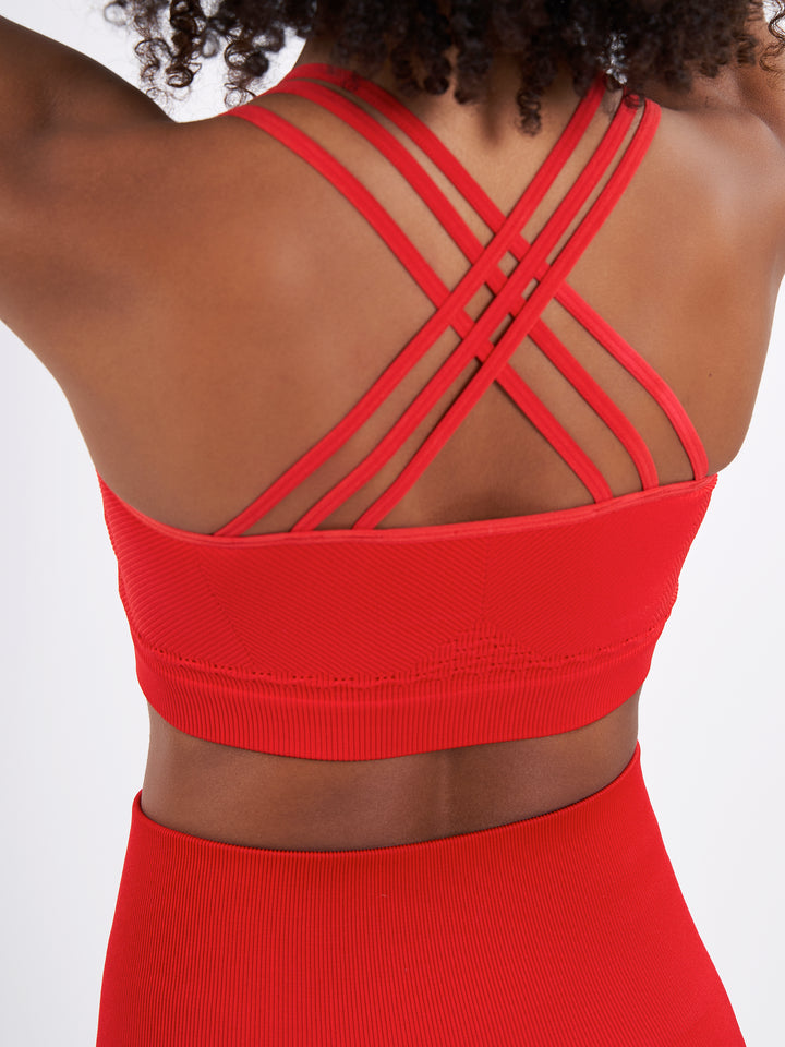 A Woman Wearing Bright Red Color Easy-Move Seamless Ribbed Crop Top for All-Day Wear