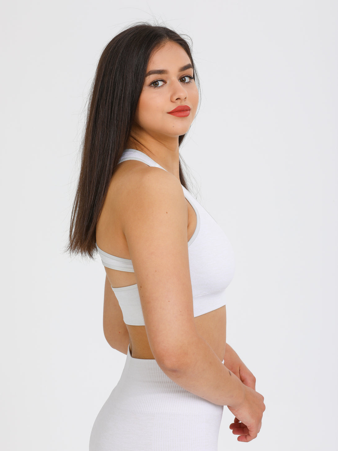 A Woman Wearing Light Grey Color Seamless Medium Support Sports Bra