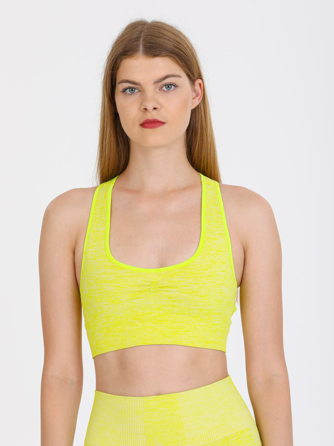 A Woman Wearing Lime Color Seamless Medium Support Sports Bra