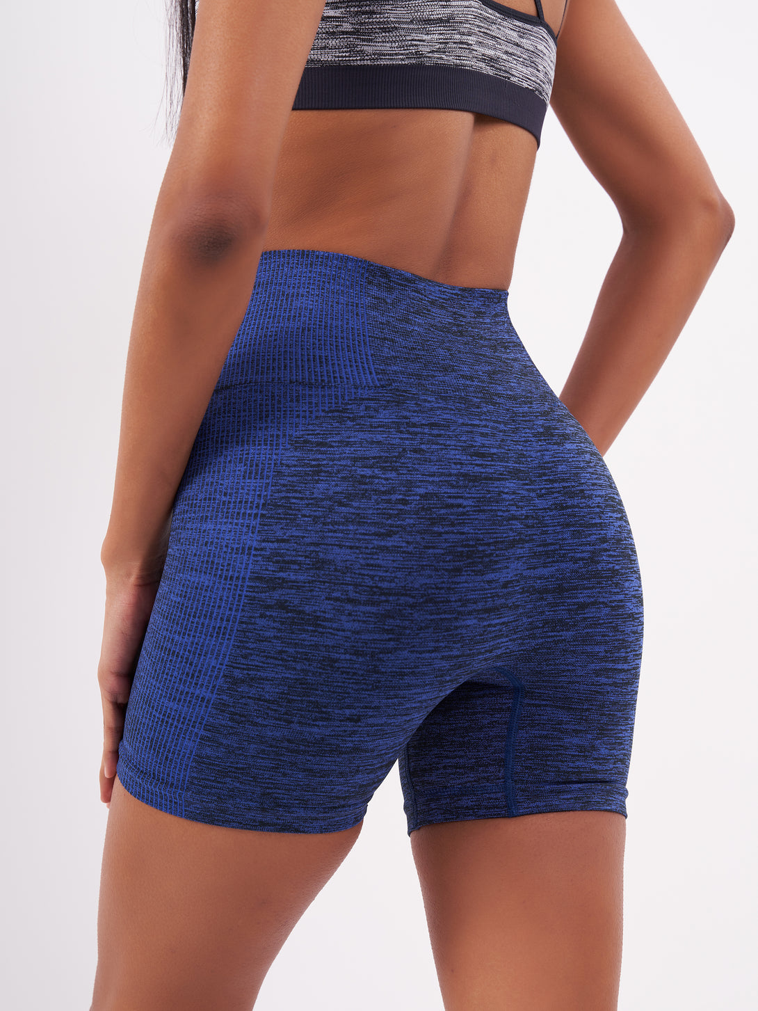 A Woman Wearing Amparo Blue Color Seamless Melange Shorts