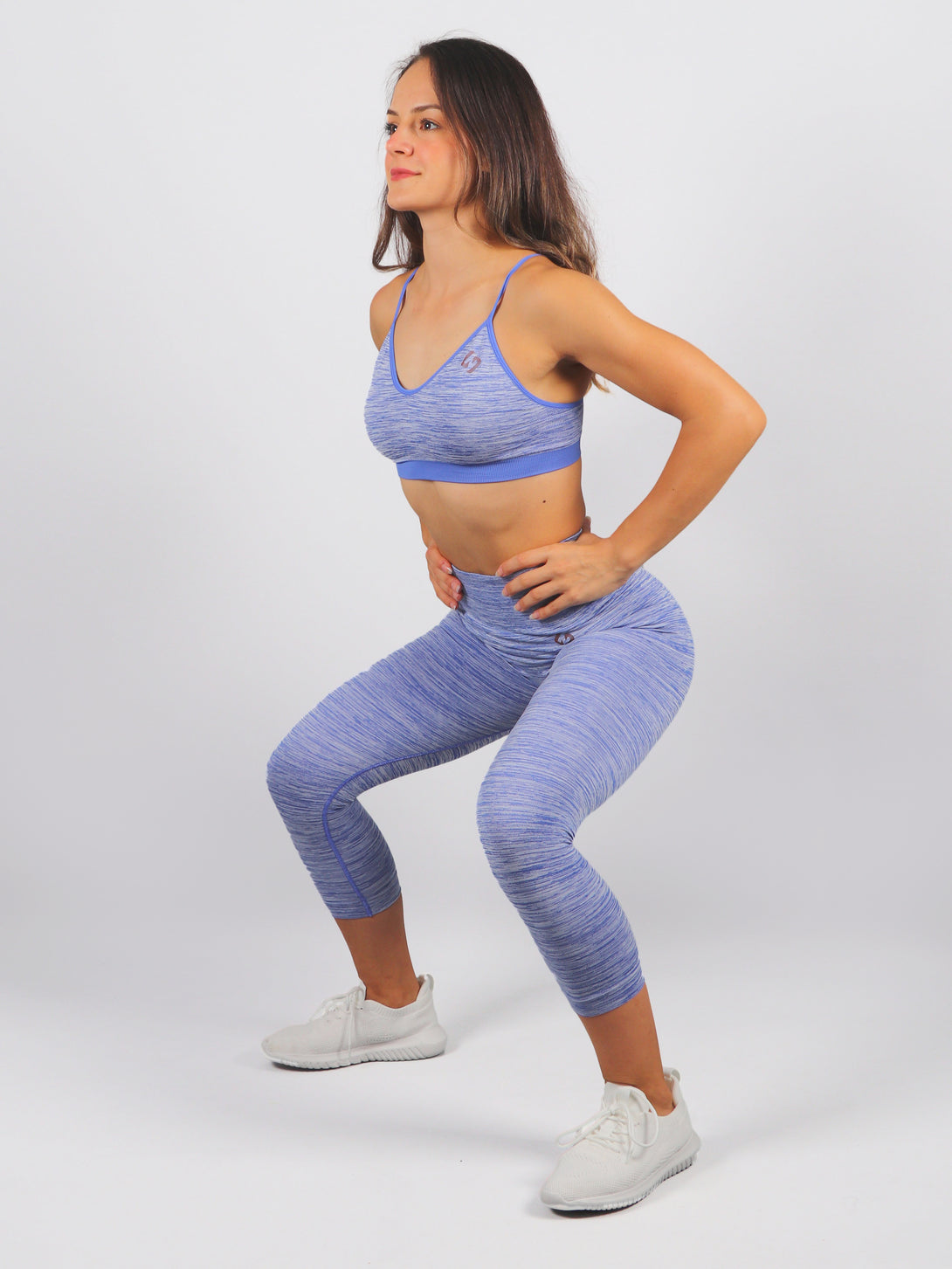 A Woman Wearing Amparo Blue Color Seamless Reversible Light Support Sports Bra