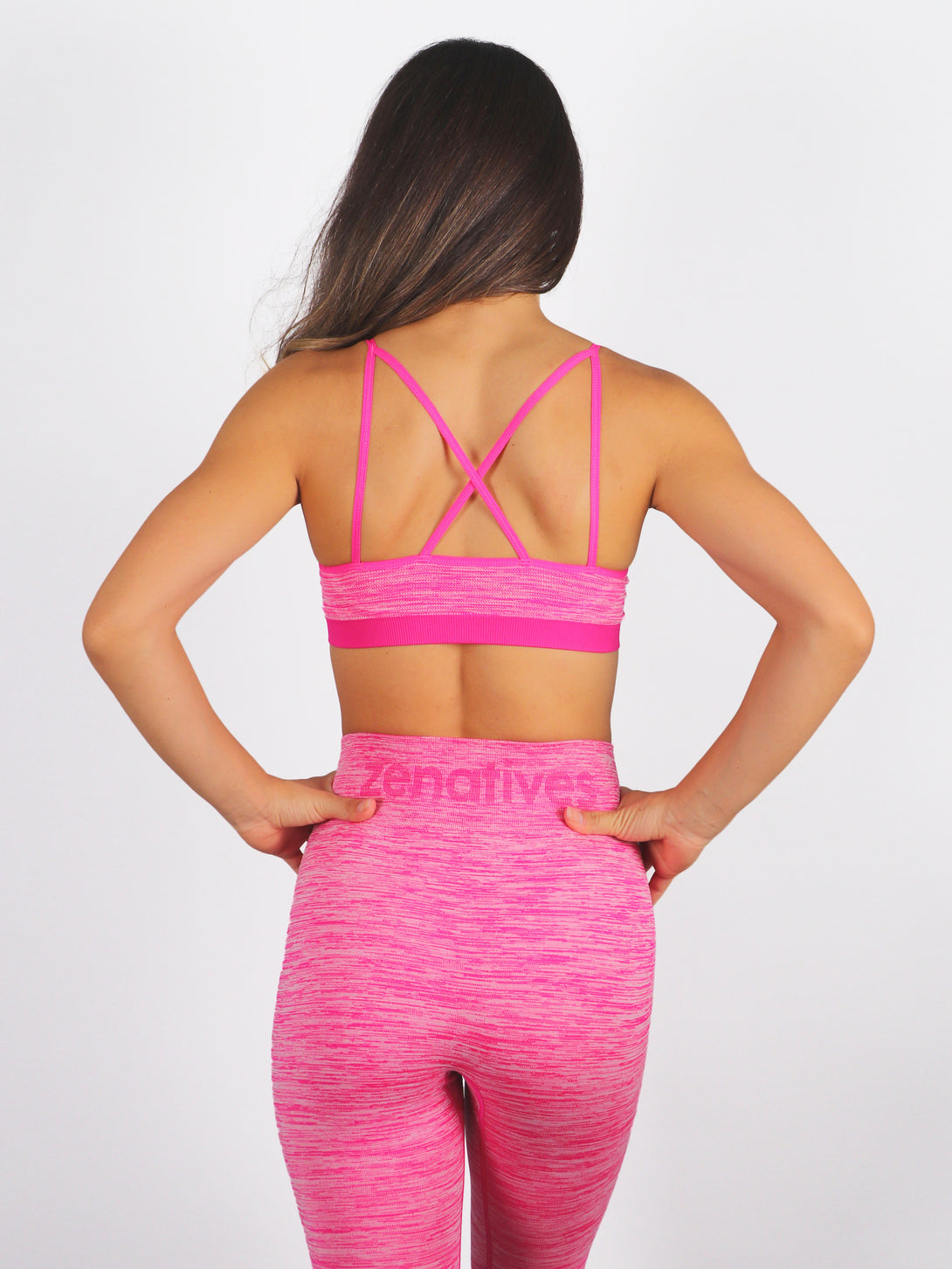 A Woman Wearing Beetroot Purple Color Seamless Reversible Light Support Sports Bra
