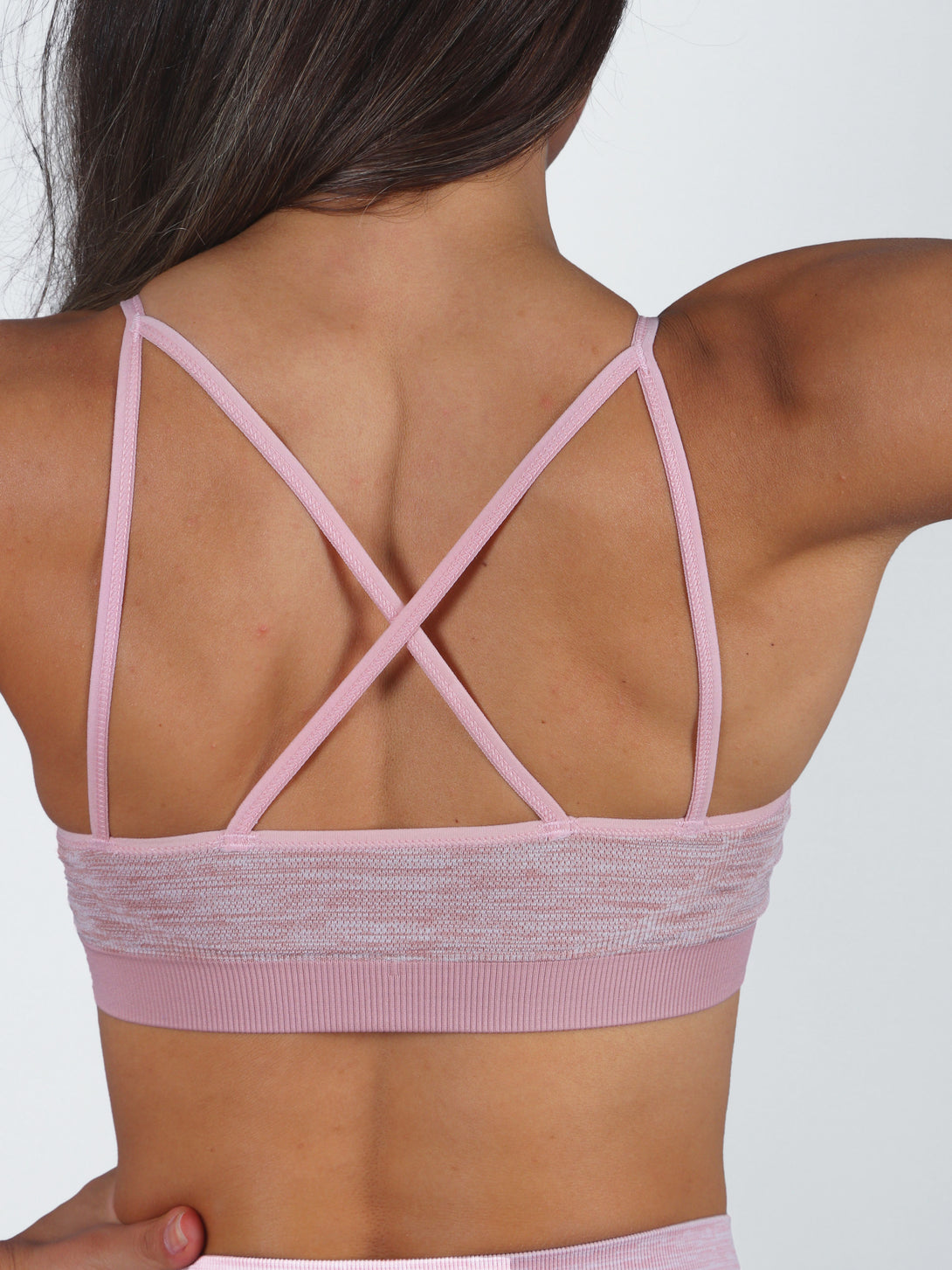 A Woman Wearing Pale Mauve Color Seamless Reversible Light Support Sports Bra