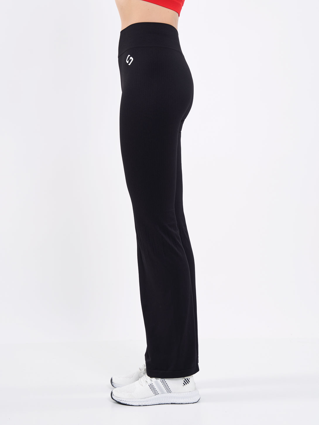 A Woman Wearing Deep Black Color Antigravity Seamless Flare-Leg Yoga Pants. Ultra-Light