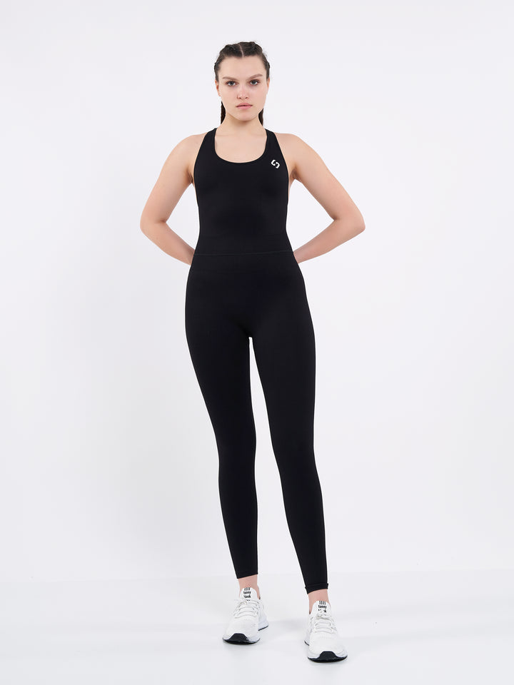 A Woman Wearing Deep Black Color Seamless Yoga Jumpsuit. Perfect Fit. Extra Flexible-Light