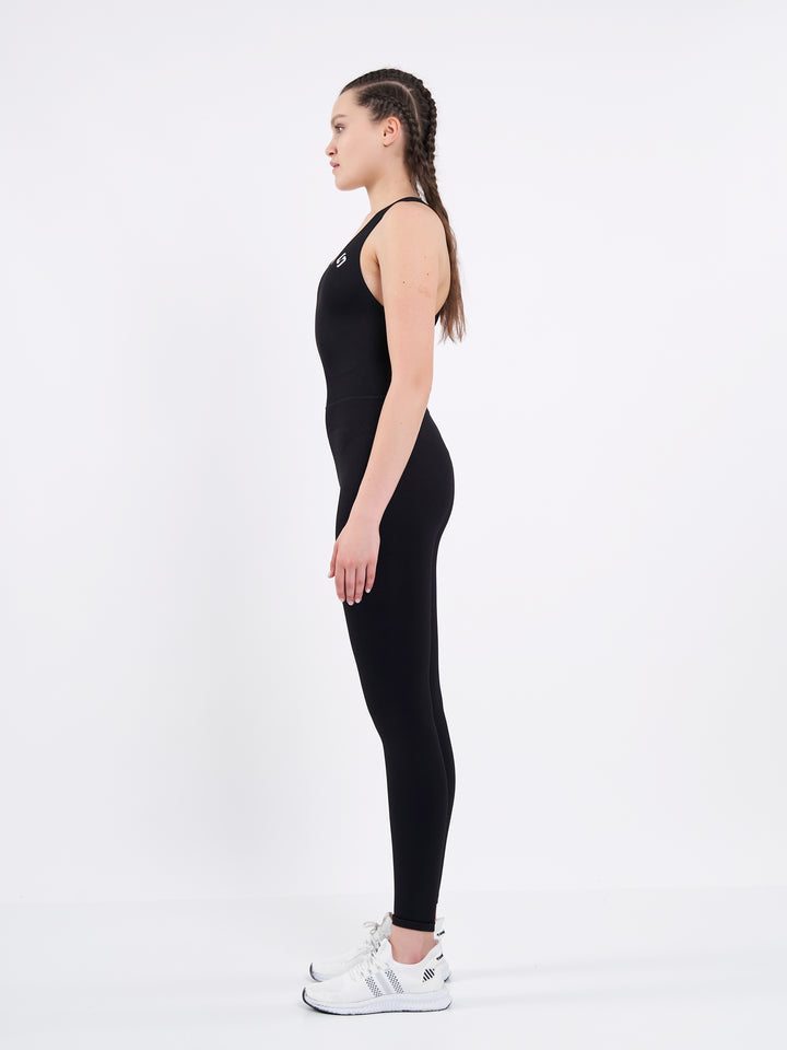 A Woman Wearing Deep Black Color Seamless Yoga Jumpsuit. Perfect Fit. Extra Flexible-Light