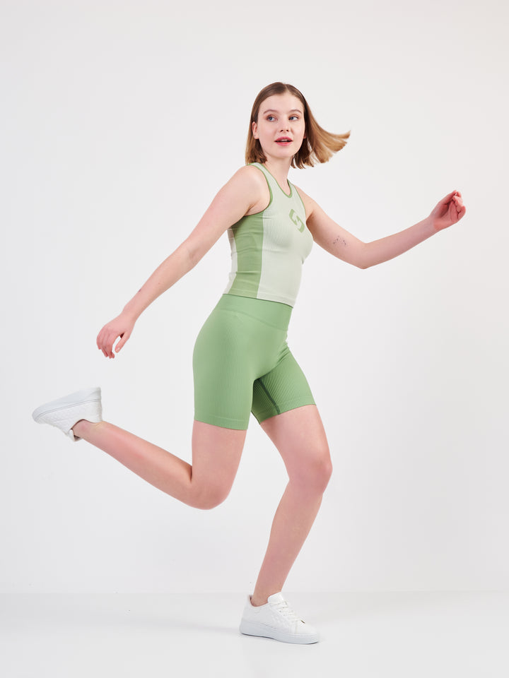 A Woman Wearing Misty Green Color Easy-Move Seamless Ribbed Crop Top for All-Day Wear