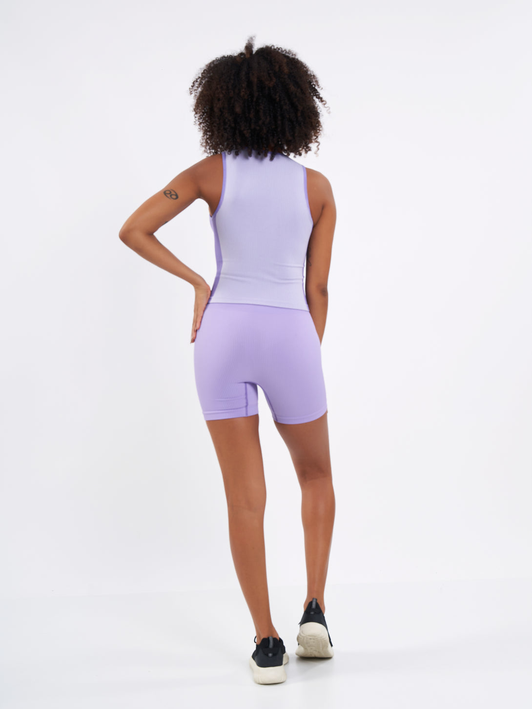A Woman Wearing Paisley Purple Color Easy-Move Seamless Ribbed Short for All-Day Wear