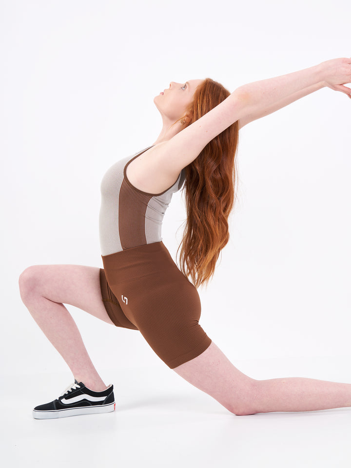 A Woman Wearing Toffee Color Easy-Move Seamless Ribbed Crop Top for All-Day Wear