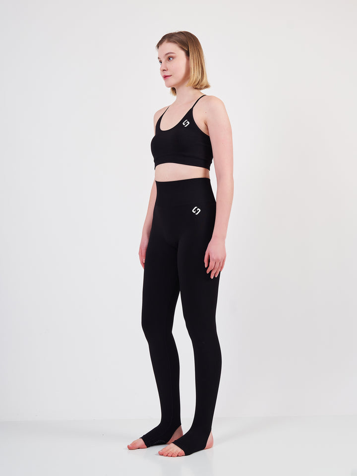 A Woman Wearing Deep Black Color Seamless High-Waist Anti-Slip Yoga Leggings. Super Flexible
