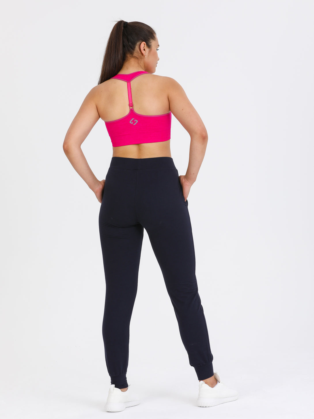 A Woman Wearing Beetroot Purple Color Single Back Strap Medium-Support Sports Bra