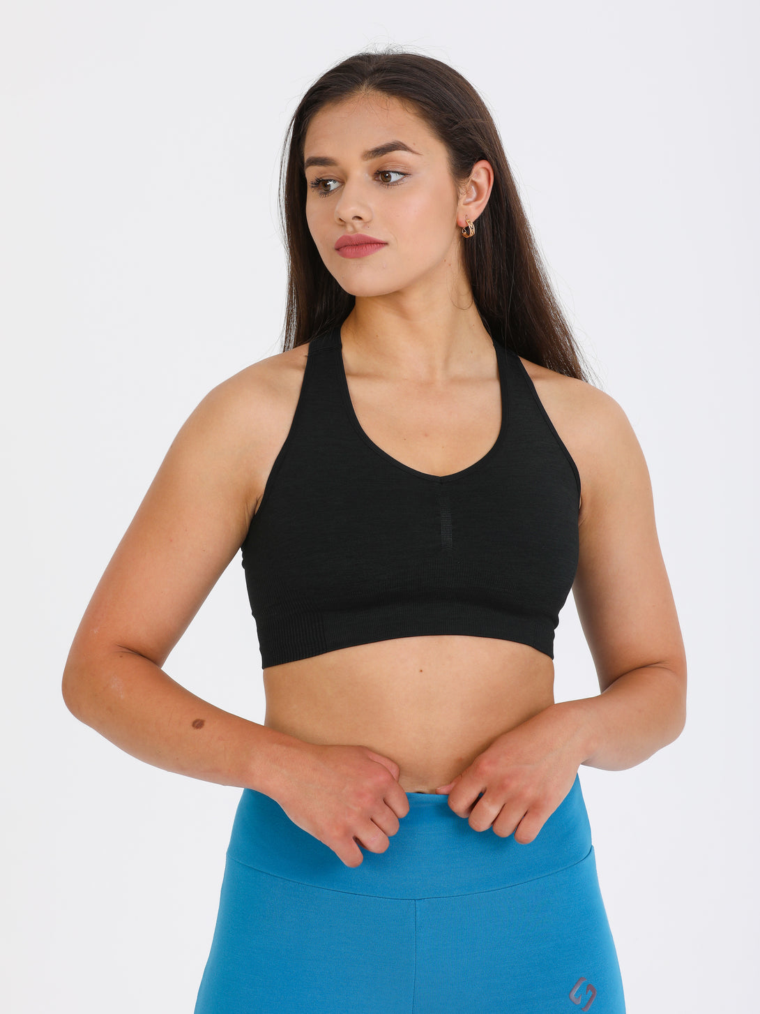 A Woman Wearing Black Color Single Back Strap Medium-Support Sports Bra