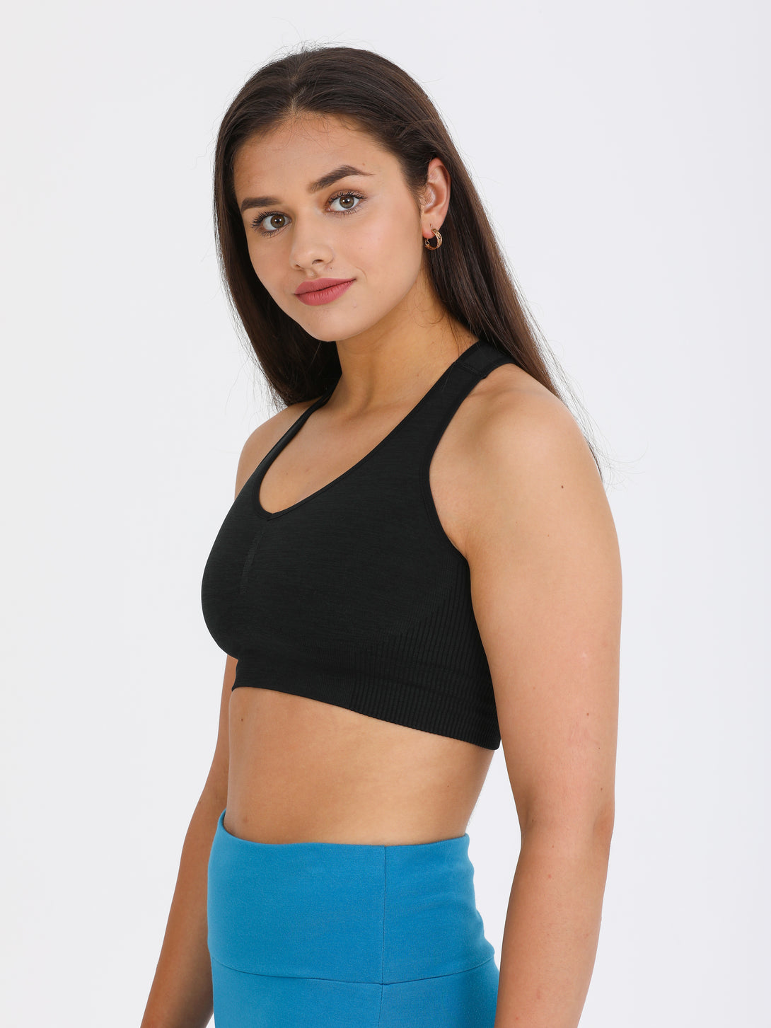 A Woman Wearing Black Color Single Back Strap Medium-Support Sports Bra