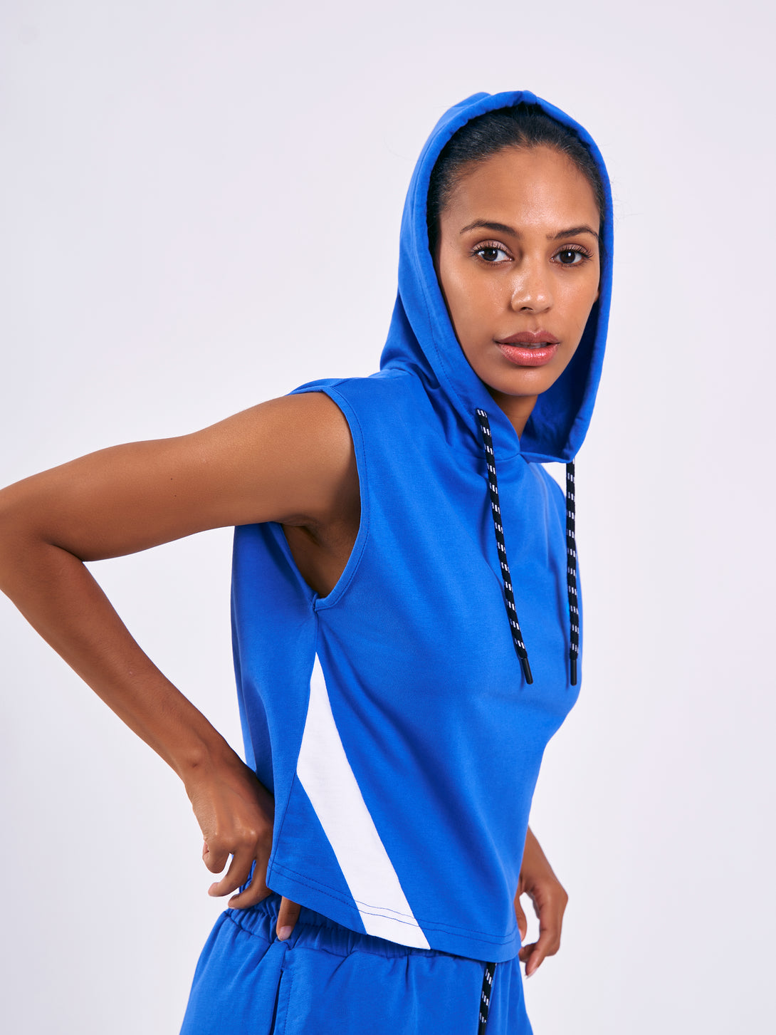 A Woman Wearing Performance Blue Color Training Sleeveless Hoodie