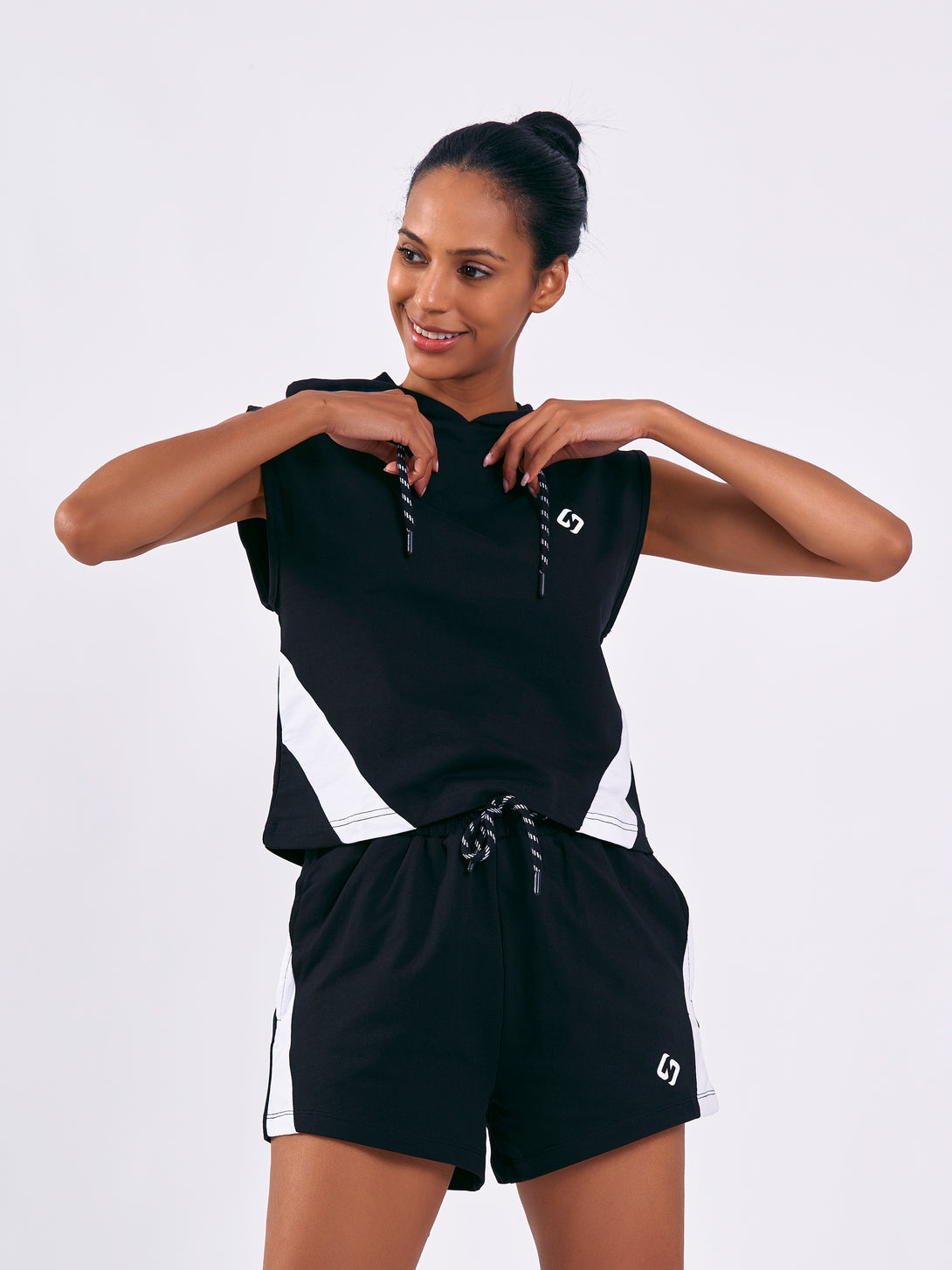 A Woman Wearing Deep Black Color Training Sleeveless Hoodie