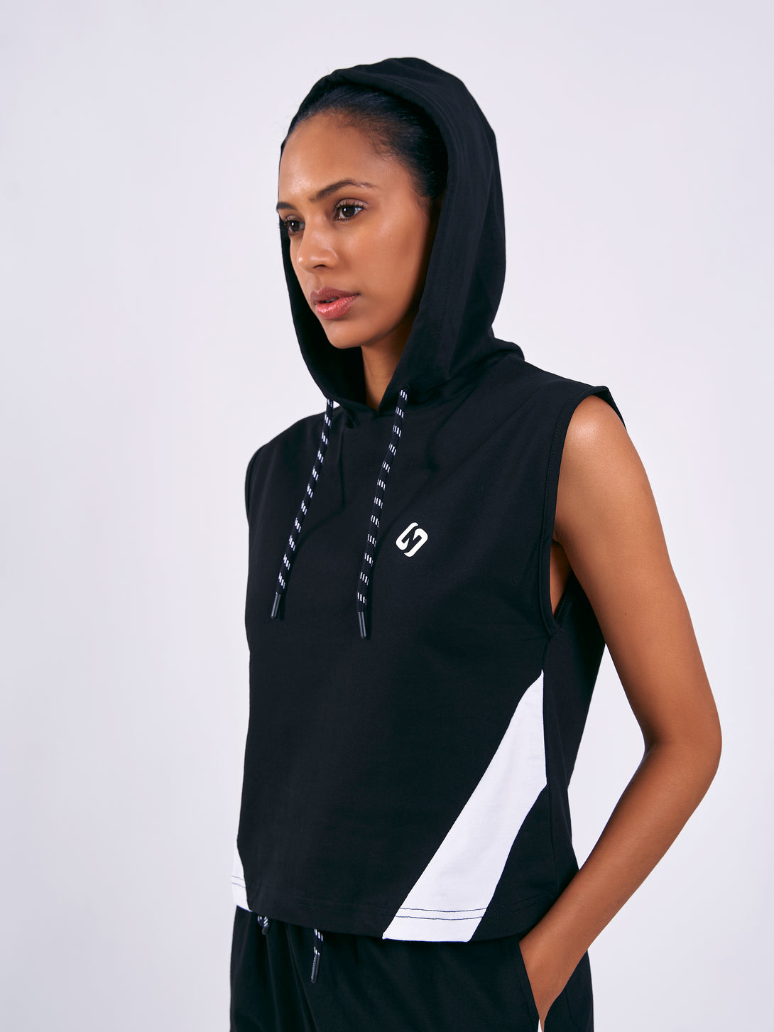 A Woman Wearing Deep Black Color Training Sleeveless Hoodie