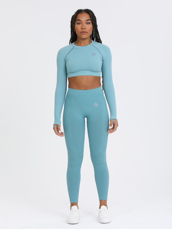 A Woman Wearing Arctic Color The Main Long Sleeve Crop Top