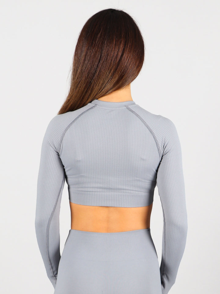 A Woman Wearing Stone Color The Main Long Sleeve Crop Top