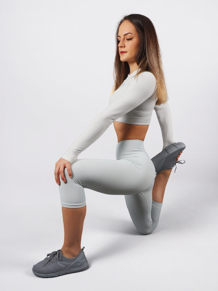 A Woman Wearing Whisper Color The Main Long Sleeve Crop Top