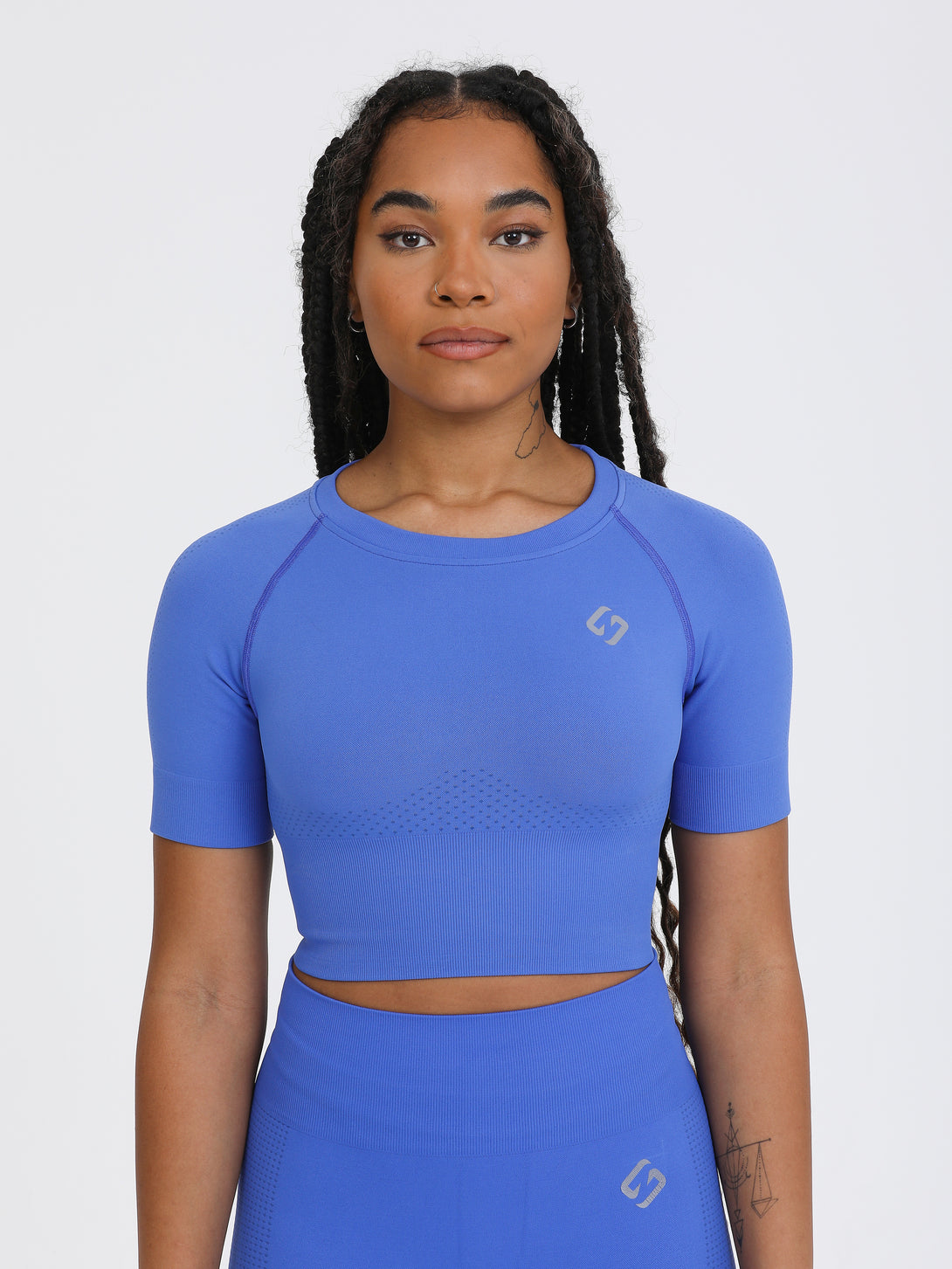 A Woman Wearing Amparo Blue Color The Main Short Sleeve Crop Top