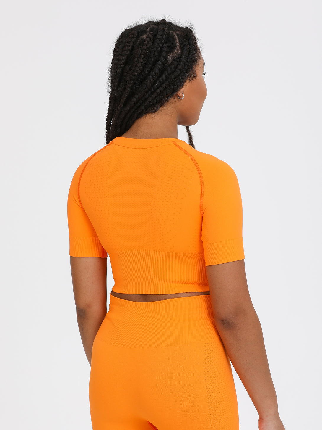 A Woman Wearing Orange Color The Main Short Sleeve Crop Top
