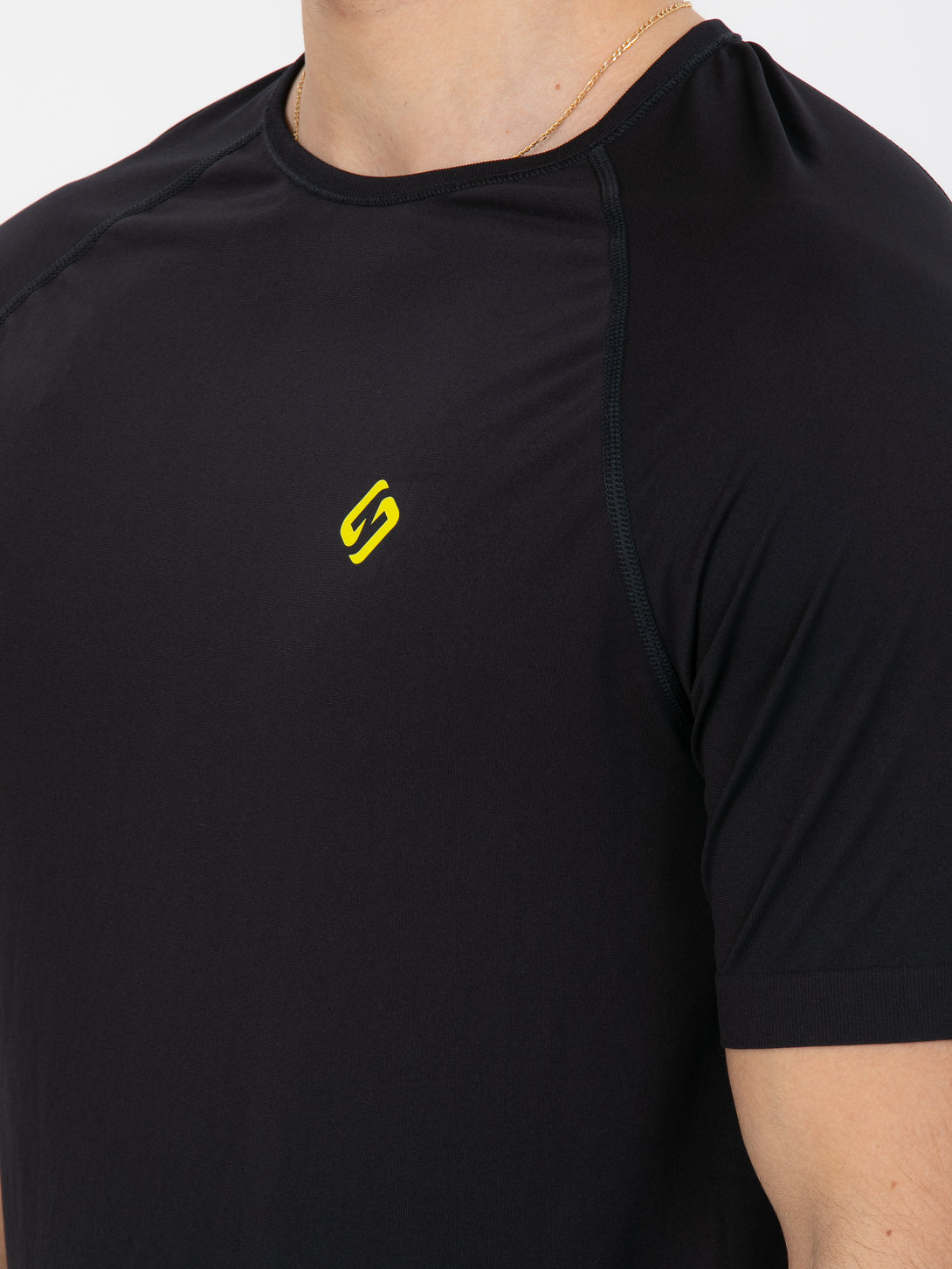 A Man Wearing Black Color Seamless The Motion T-Shirt