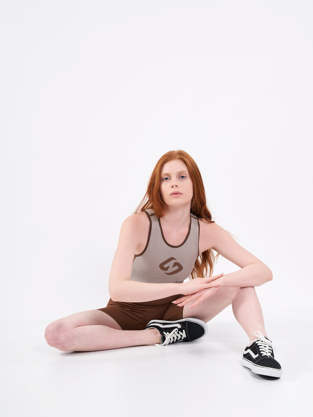 A Woman Wearing Toffe Brown Color Easy-Move Seamless Ribbed Crop Top for All-Day Wear