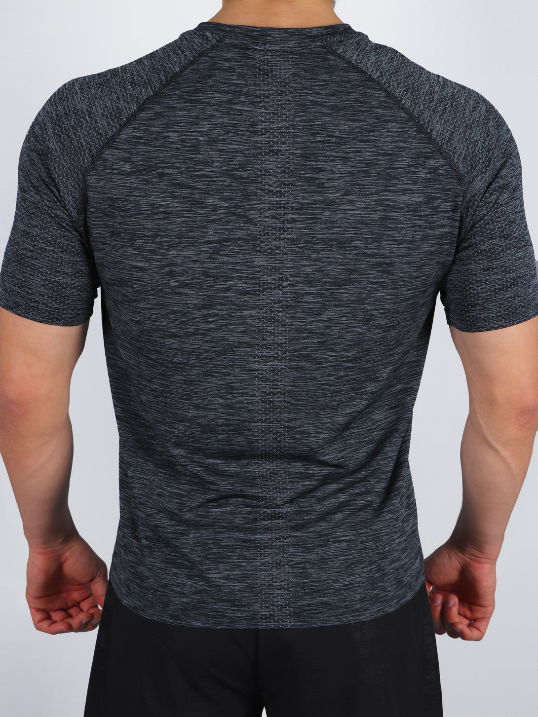 A Man Wearing Black Color Seamless Workout Comfort T-Shirt