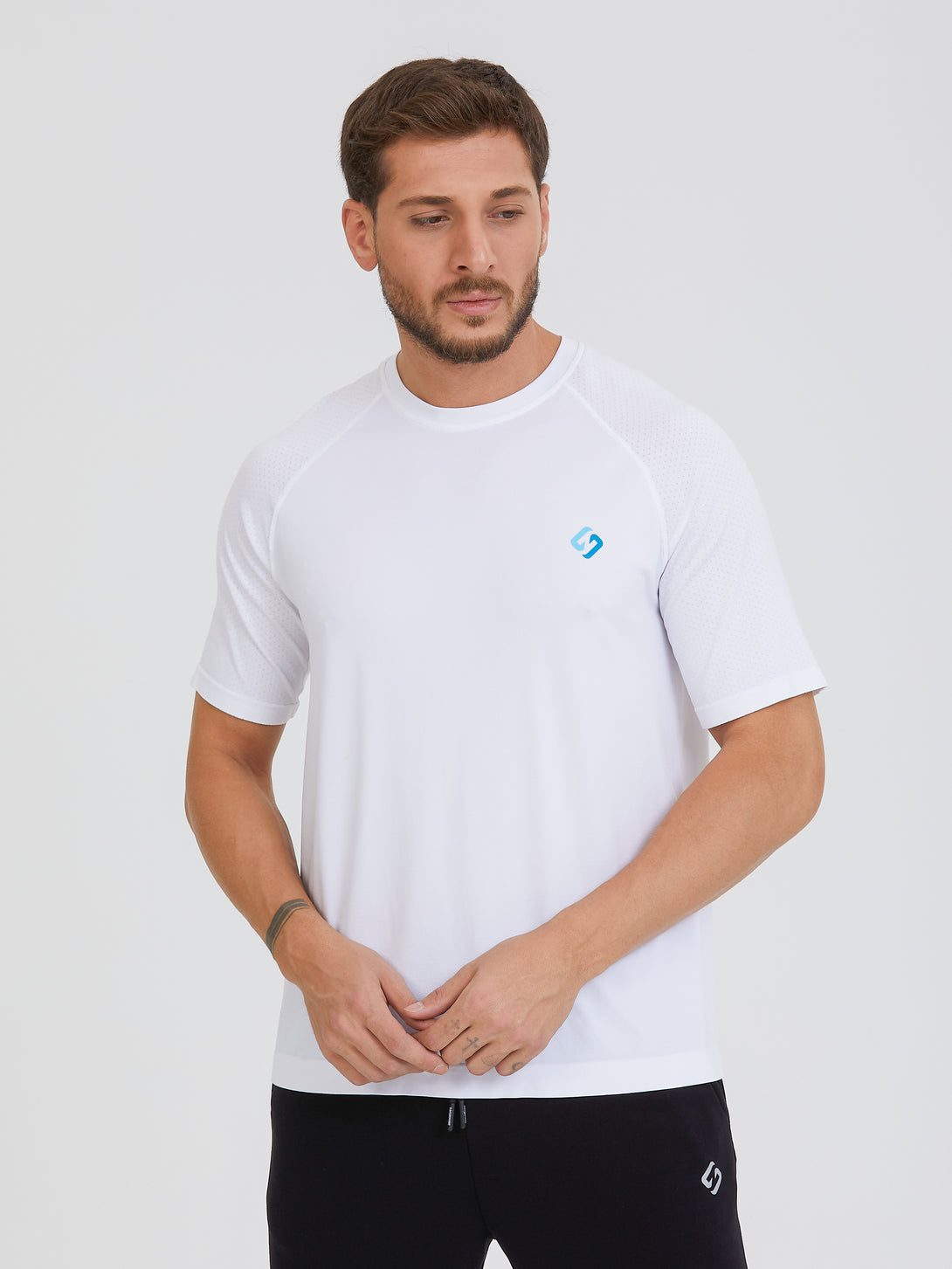 A Man Wearing White Color Seamless Workout Comfort T-Shirt
